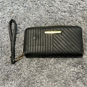 Lightly used black with gold interior Steve Madden wristlet wallet